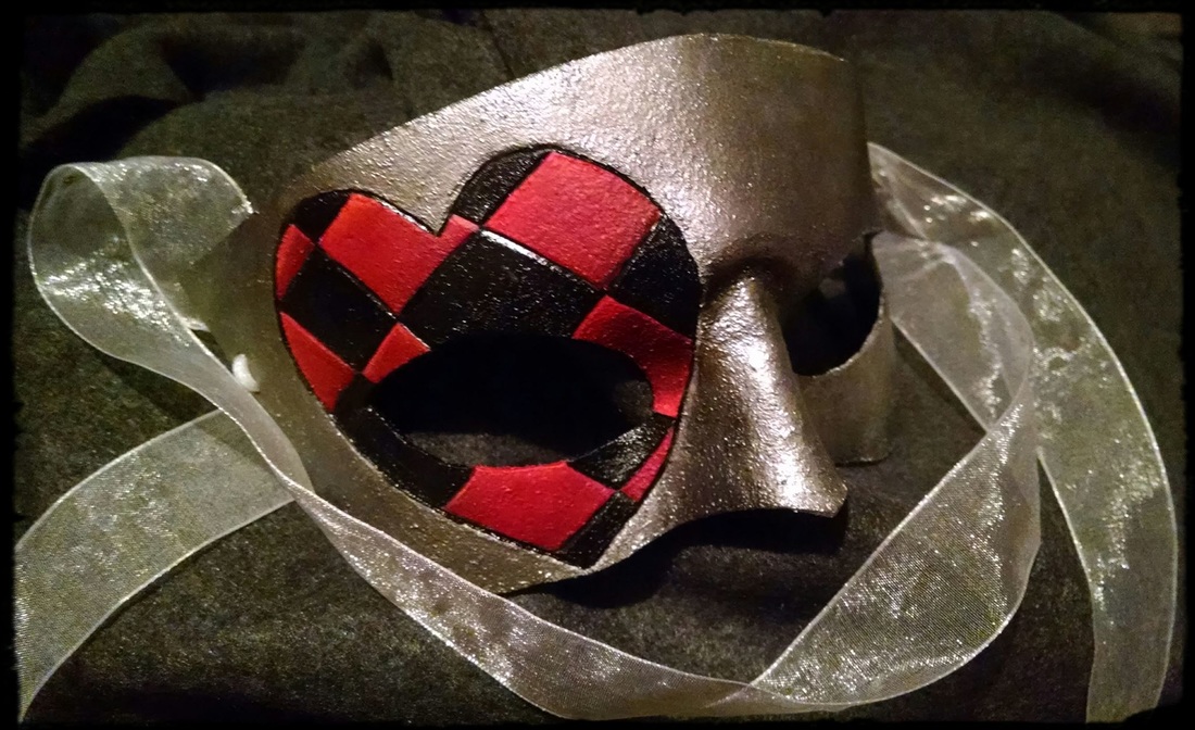small leather mask, silver with heart tooling